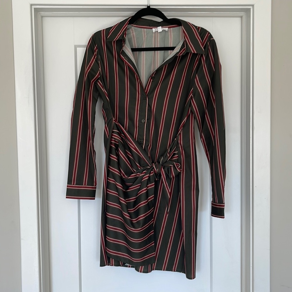 Worn once - green stripped dress with bow and shaping on front side of dress